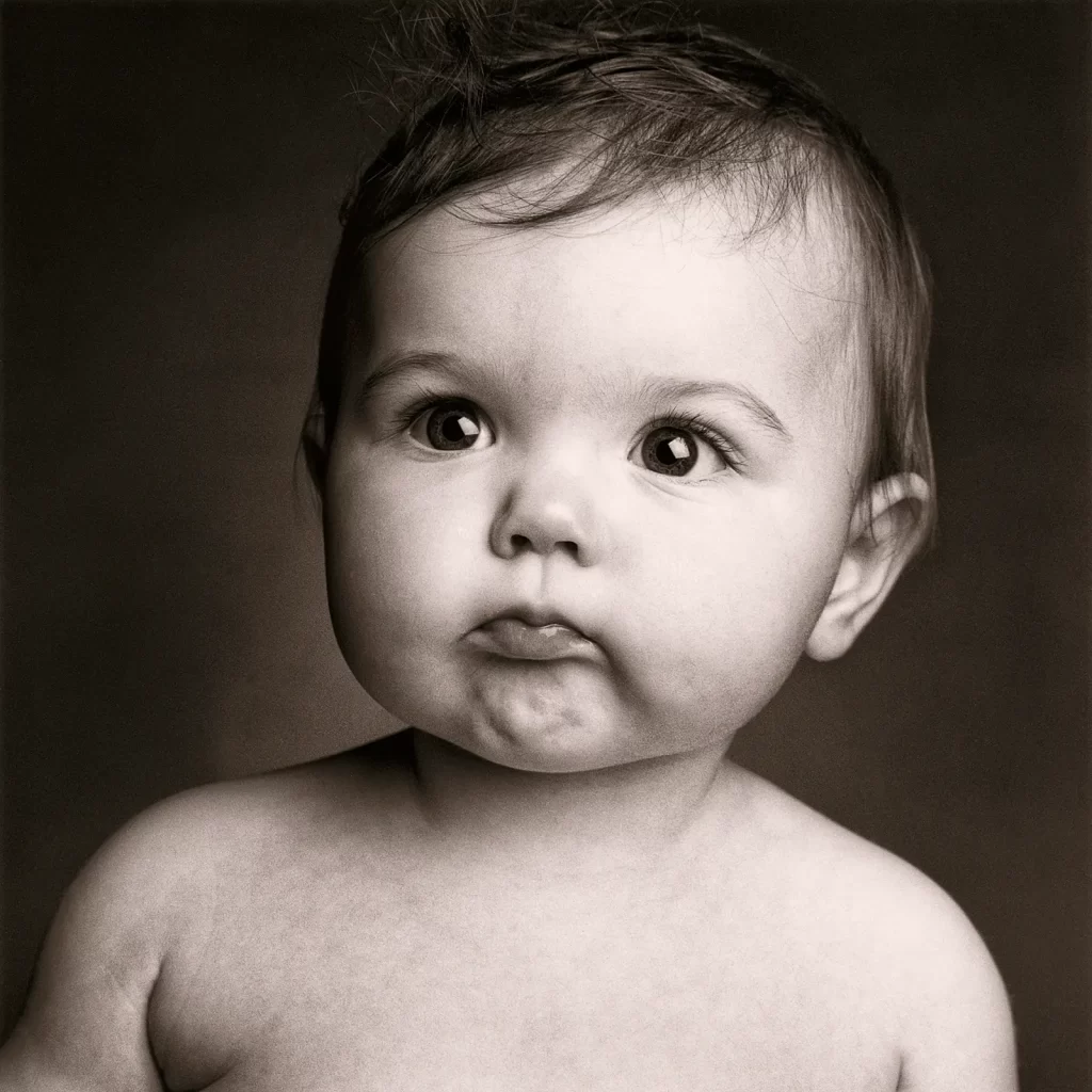 Black and white portrait of a baby girl.
