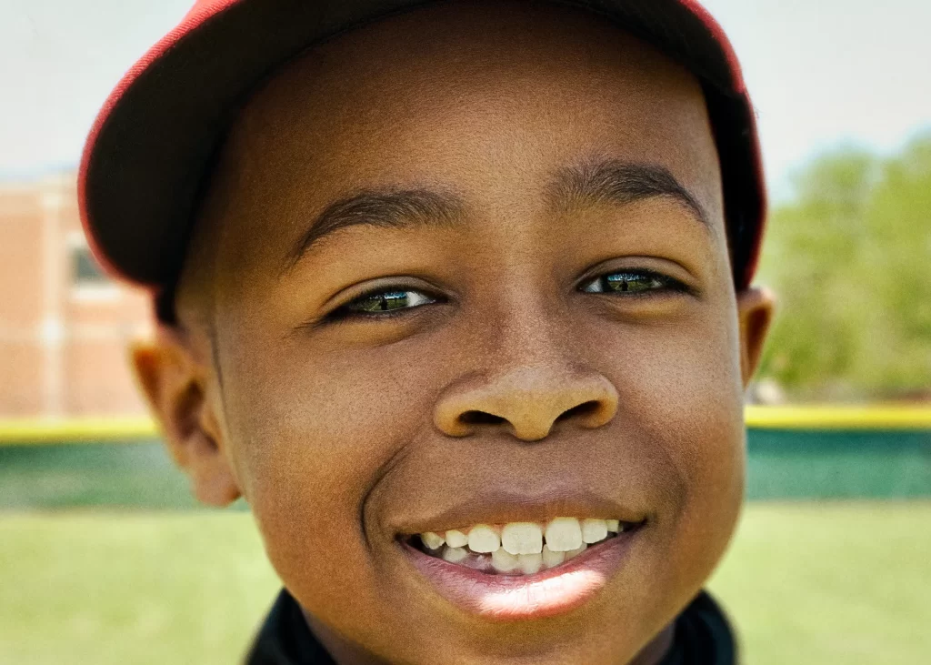 Close-up portrait of a little league baseball player. William.