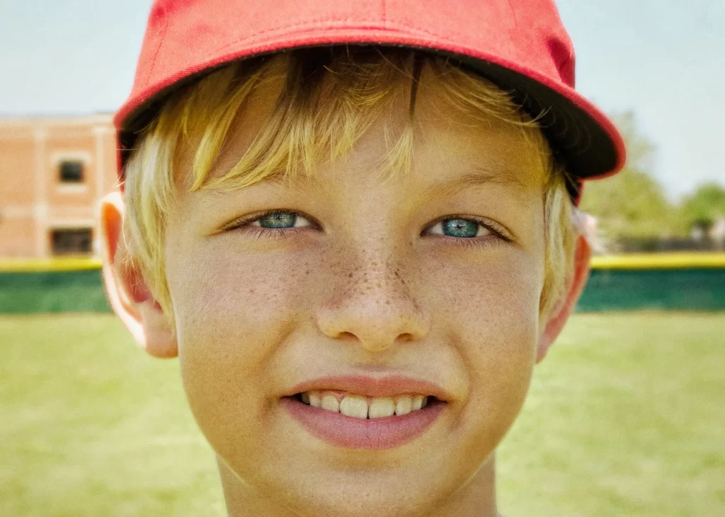 Close-up portrait of a little league baseball player. Zane.