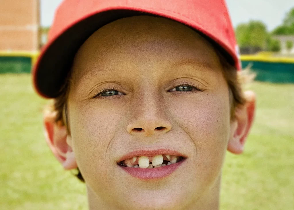 Close-up portrait of a little league baseball player. Cameron.